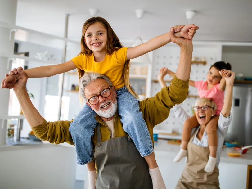 Grandparents playing with grandchildren
